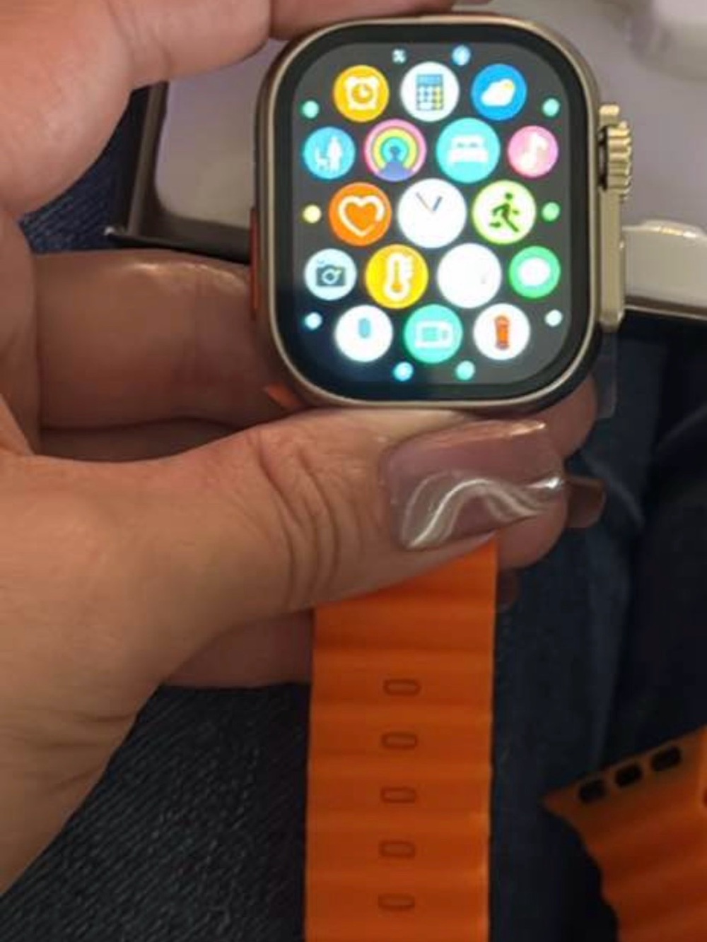 Smartwatch with Orange Sport Band and Silver Case - Sleek Touchscreen Wearable